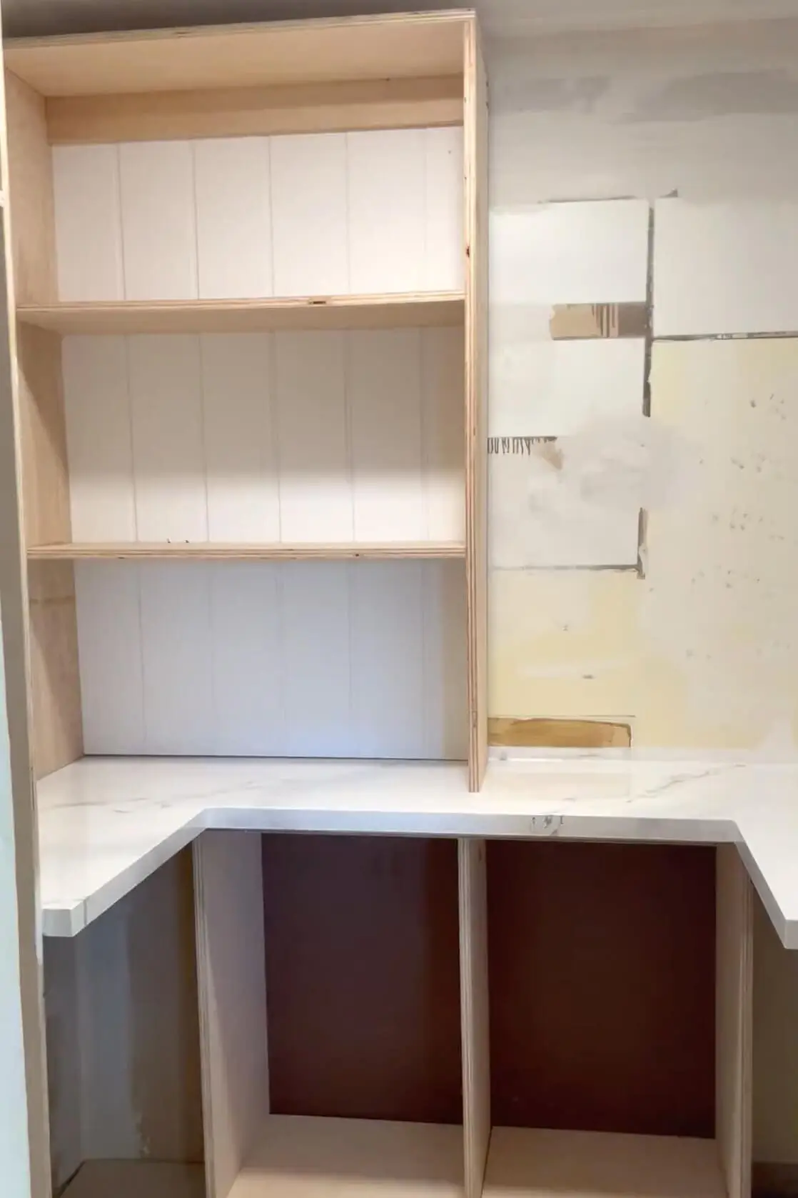 Putting shelves in pantry.